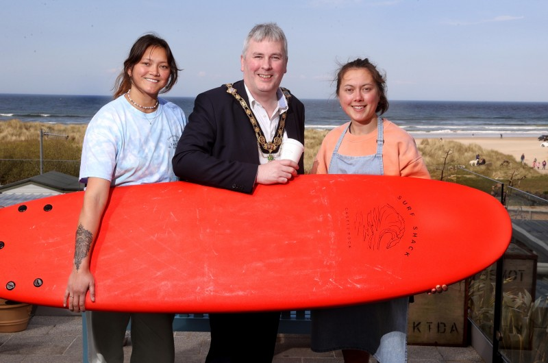 The Mayor of Causeway Coast and Glens Borough Council, Councillor Richard Holmes, pictured with Leanne and Linsey Lyons from The Surf Shack in Castlerock.