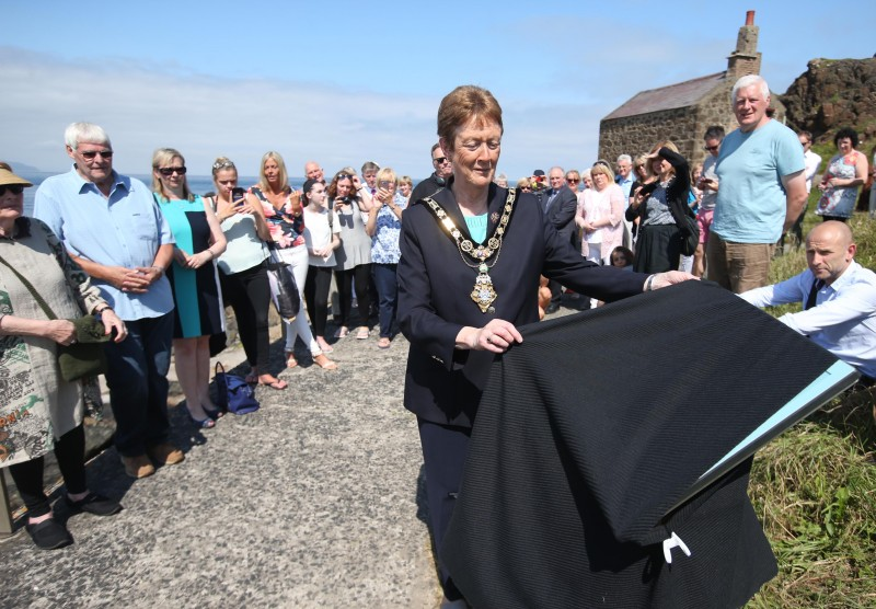 The Mayor of Causeway Coast and Glens Borough, Councillor Joan Baird OBE, prepares to unveil the new discovery point plaque at Berne Harbour.