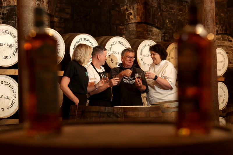 Wendy Gallagher from Causeway Coast Foodie Tours, Gary Stewart, owner of Tartine at the Distillers Arms, Ruaridh Morrison, owner of North Coast Smokehouse,and celebrity chef Paula McIntrye sample some whiskey at Bushmills Distillery.