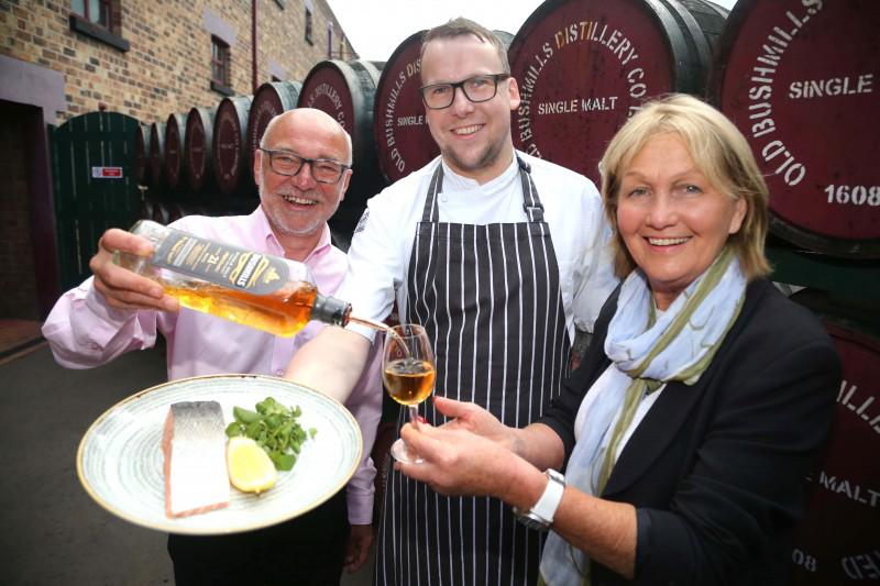 Nial Mehaffey and Chris Gibson from Bushmills Distillery pictured with celebrity chef Jenny Bristow at the launch of the Bushmills Salmon and Whiskey Festival which takes place on June 17th and 18th