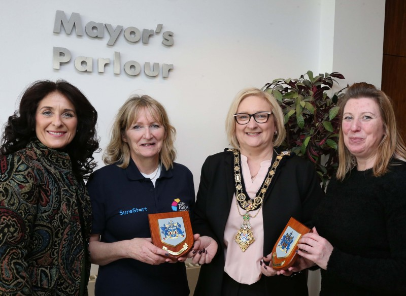 The Mayor of Causeway Coast and Glens Borough Council Councillor Brenda Chivers presents the Coat of Arms to Brenda MacQueen and Kathy Greeve along with Lucille Wright.