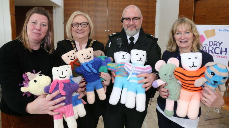 The Mayor of Causeway Coast and Glens Borough Council Councillor Brenda Chivers pictured with a selection of the knitted trauma teddies with Lucille Wright, Sergeant Darrell McIvor and Kathy Greeve.