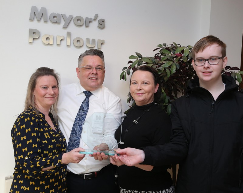 Terry McVeigh, a Macmillan Palliative Care Nurse Specialist at Causeway Hospital, pictured with the Mayor of Causeway Coast and Glens Borough Council Councillor Sean Bateson, his nieces Valerie and Anita Mullan and his great-nephew Joel Jenkins at a recent reception to recognise his success at this year’s RCN Nurse of the Year Awards where he received the Patients’ Choice Award.
