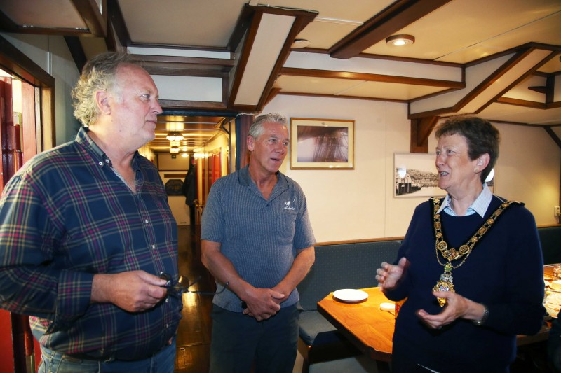 The Mayor of Causeway Coast and Glens Borough Council, Councillor Joan Baird OBE, chats with Captain Jacob Wam and passenger Hans Jutte.