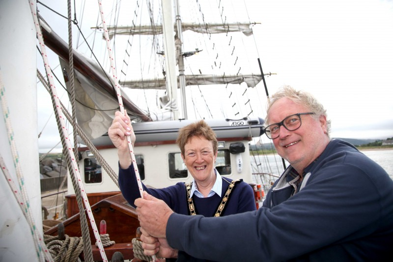 The Mayor of Causeway Coast and Glens Borough Council, Councillor Joan Baird OBE, helps out on desk with Thalassa Captain Jacob Wam.