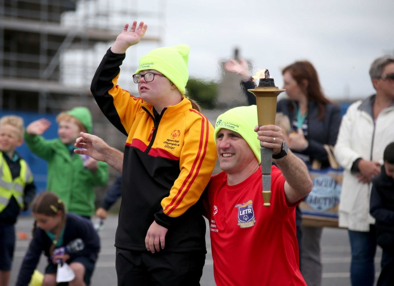 The Flame of Hope arrives in Portrush with members of the Law Enforcement Torch Run and Special Olympics athletes.