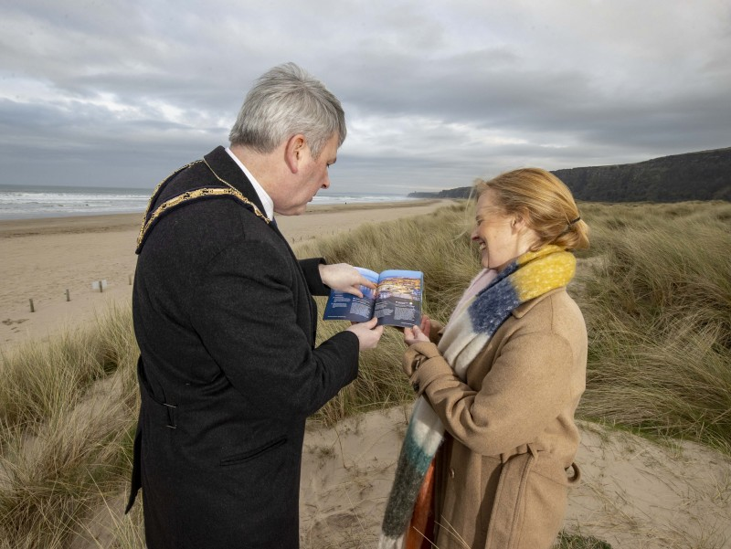 The Mayor of Causeway Coast and Glens Borough Council Councillor Richard Holmes pictured at Benone with Destination Manager Kerrie McGonigle for the launch of the latest Causeway Coast and Glens Visitor Guide which is available now.