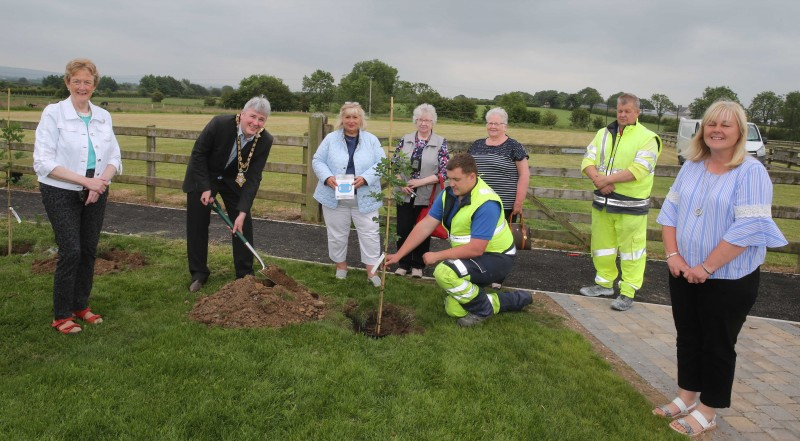 Mary McCracken with Eileen White and Doreen Patton MBE, representing Mosside WI pictured with the Mayor of Causeway Coast and Glens Borough Council, Councillor Richard Holmes, Councillor Joan Baird, Councillor Margaret Anne McKillop, and Council staff at the tree planting event in Mosside.