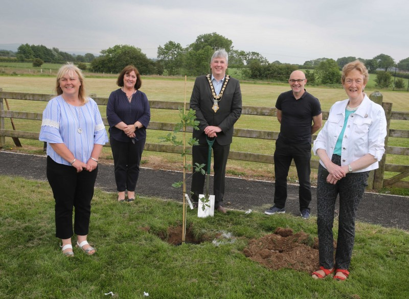 Fergal Barr from Causeway Coast and Glens Borough Council’s Community Development team and Joy Wisener from the Good Relations team, pictured with the Mayor of Causeway Coast and Glens Borough Council, Councillor Richard Holmes, Councillor Joan Baird, Councillor Margaret Anne McKillop, and Council staff at the tree planting event in Mosside.