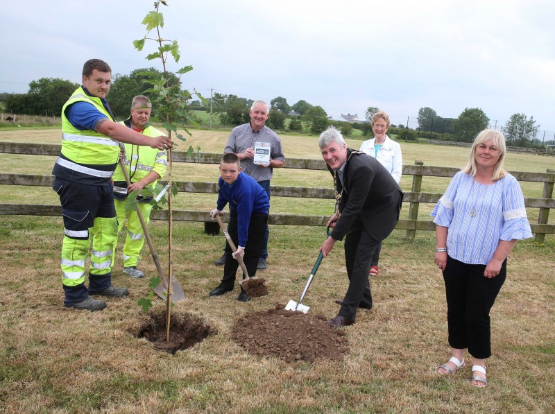 Ben Kennedy and David Rowe representing Mosside Boys’ Brigade, pictured with the Mayor of Causeway Coast and Glens Borough Council, Councillor Richard Holmes, Councillor Joan Baird, Councillor Margaret Anne McKillop and Council staff at the tree planting event in Mosside.