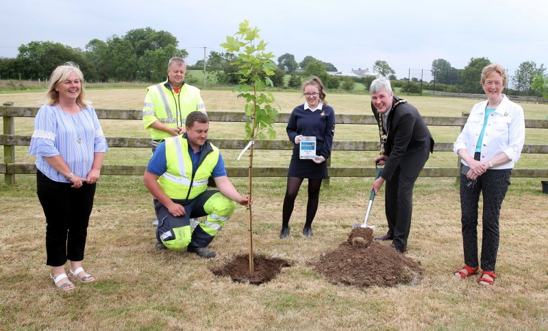 Amelia Scott representing Mosside Girls’ Brigade pictured with the Mayor of Causeway Coast and Glens Borough Council Councillor Richard Holmes, Councillor Joan Baird, Councillor Margaret Anne McKillop and Council staff at the tree planting event in Mosside.