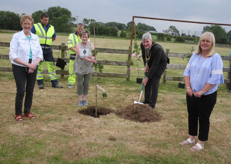 Anne Hickinson representing Mosside Orange Lodge pictured with the Mayor of Causeway Coast and Glens Borough Council Councillor Richard Holmes, Councillor Joan Baird, Councillor Margaret Anne McKillop and Council staff at the tree planting event in Mosside.