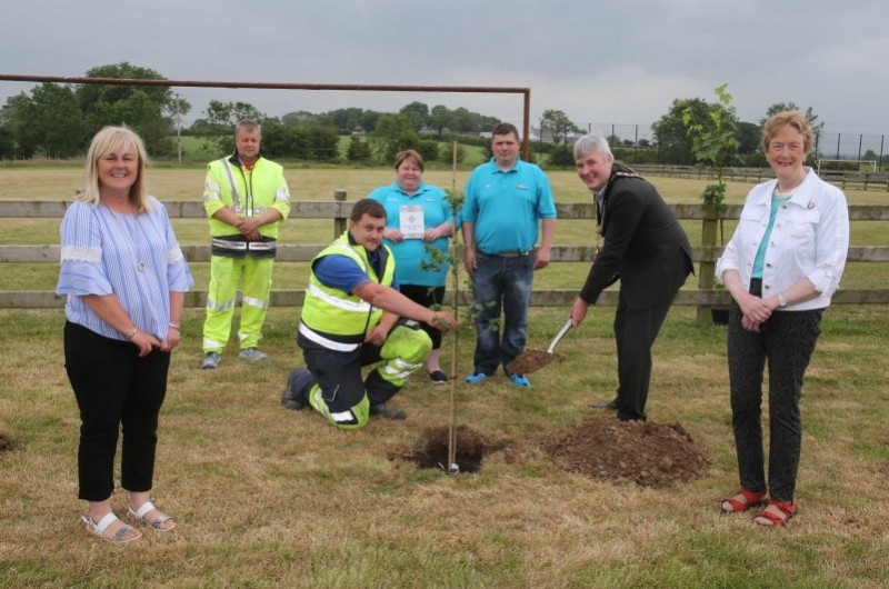 Michelle Wilmont and Jim Wilmont from Mosside Youth Club & Hub pictured with the Mayor of Causeway Coast and Glens Borough Council, Councillor Richard Holmes, Councillor Joan Baird, Councillor Margaret Anne McKillop, and Council staff at the tree planting event in Mosside.