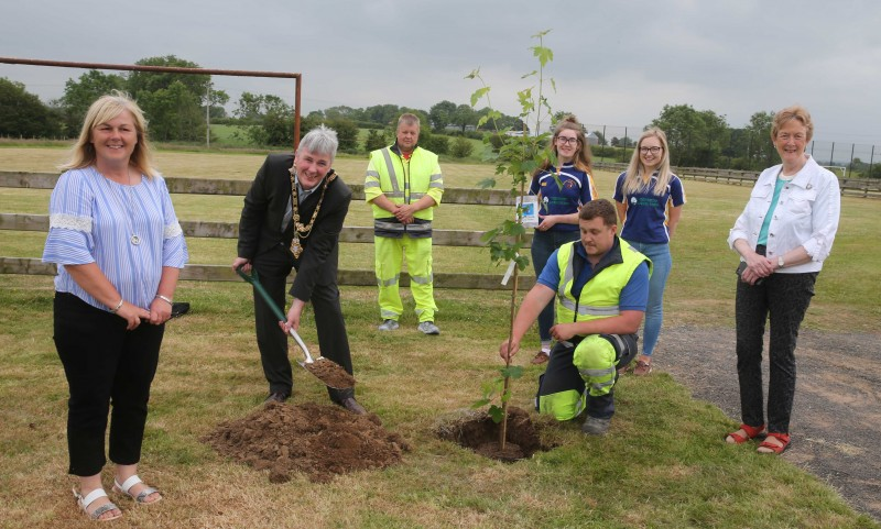 Courtney McMullan and Rachel Smith representing Moycraig Young Farmers pictured with the Mayor of Causeway Coast and Glens Borough Council, Councillor Richard Holmes, Councillor Joan Baird, Councillor Margaret Anne McKillop, and Council staff at the tree planting event in Mosside.