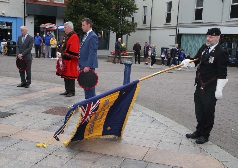 The Standard is lowered during the VJ Day commemoration held in Coleraine on Monday 16th August.