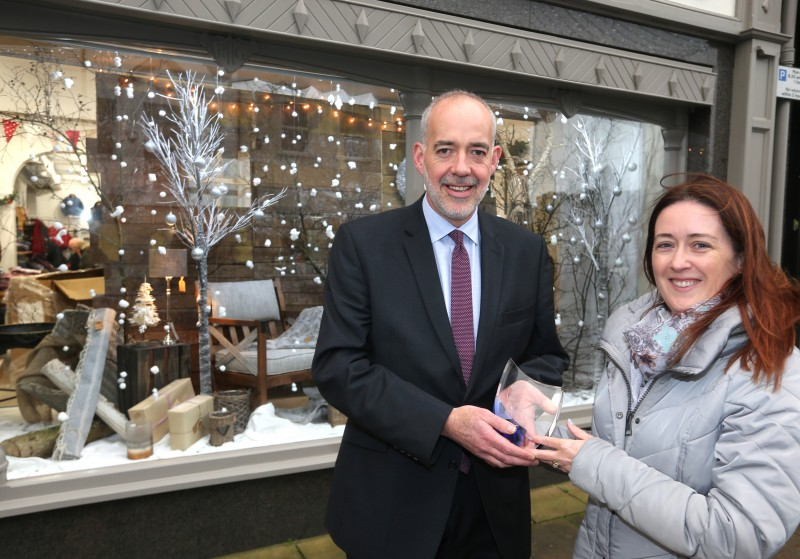 Jonathan Gault receives his prize from Causeway Coast and Glens Borough Council Officer Catrina McNeill after his shop was selected as the winner of the Christmas Window Competition in Ballymoney.