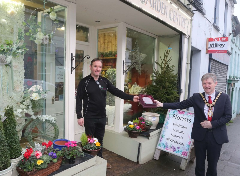Ballycastle Garden Centre was the winner of the Best Christmas Window in Ballycastle and the Mayor of Causeway Coast and Glens Borough Council Alderman Mark Fielding presented the award to Michael Magee.