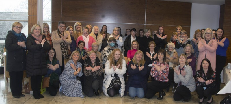 Guests who attended the International Women’s Day event in Cloonavin make the ‘Break The Bias’ gesture of solidarity.