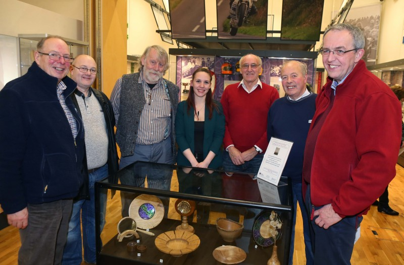 Rachael Garrett, Causeway Coast and Glens Borough Council Museum Services, pictured with a group of woodturners who exhibited their work at the launch event in Ballymoney Museum.