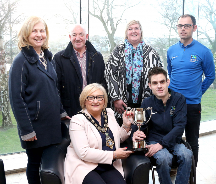 Paul McLister, the first person from Northern Ireland to win the Irish National BC4 Boccia Championship, pictured with the Mayor of Causeway Coast and Glens Borough Council Councillor Brenda Chivers, his parents Mary and Brian, Councillor Sandra Hunter and Boccia Performance Pathway Officer & Lead Coach Odhran Doherty, from Disability Sport NI.