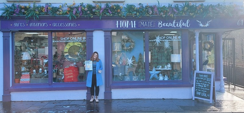 Tracey McAllister pictured with her prize after Home Made Beautiful won the Best Dressed Christmas Window in Ballycastle.