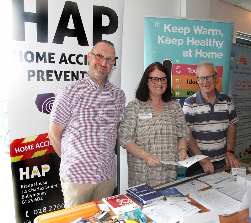 Nick Moffett, Home Accident Prevention, and Pat McGettigan, Energy Efficiency, Causeway Coast and Glens Borough Council chatting to Anne-Marie Doherty, Health and Well-being Locality Lead for Causeway area with the Northern Health & Social Care Trust.