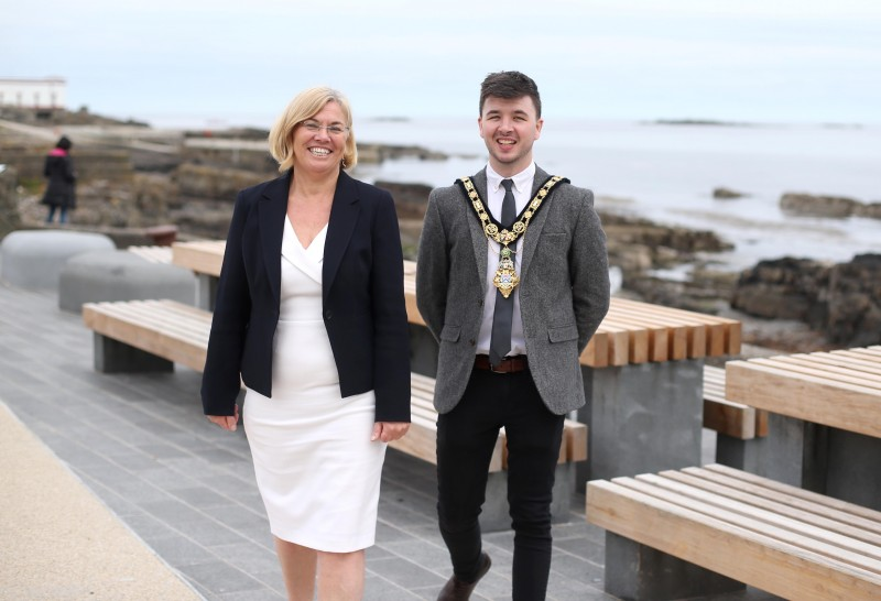 The Mayor of Causeway Coast and Glens Borough Council Councillor Sean Bateson pictured with Department for Communities Permanent Secretary Tracy Meharg as they mark the completion of a series of improvements to Portrush Town Centre as part of the £17million regeneration programme.