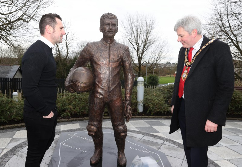 Michael Dunlop and the Mayor of Causeway Coast and Glens Borough Council Councillor Richard Holmes view the statue of William Dunlop which is now in place in the Dunlop Memorial Gardens in Ballymoney.