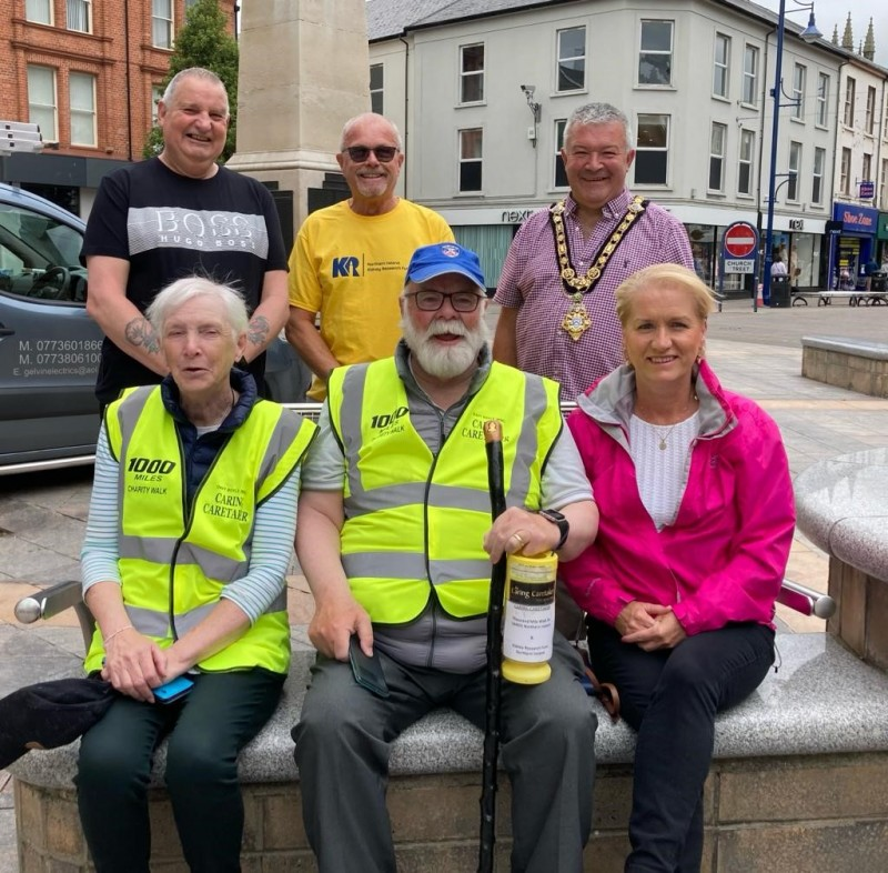 The Mayor of Causeway Coast and Glens Borough Council Councillor Ivor Wallace pictured with (back row, left-right), Nevin Boyle, Denis McNeill, (front row, left – right) Teresa Boyle, Davy Boyle and Helen McNeill in Coleraine after completing a leg of Davy’s latest walking charity challenge.