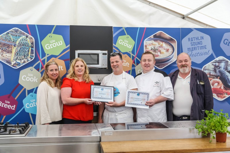 Gary Stewart (centre) receives his certificate after winning the Ulster Chowder Cook-Off heat at Rathlin Sound Maritime Festival last year.