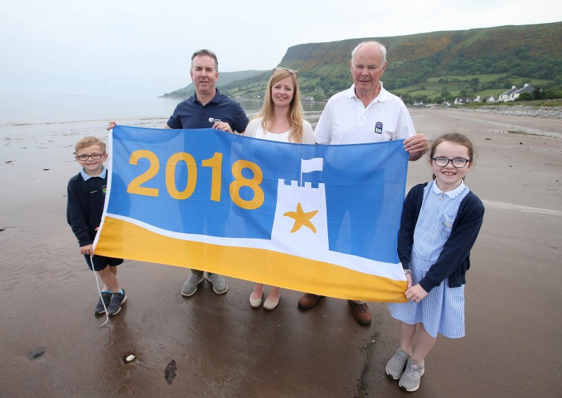 Michael McConaghy from Causeway Coast and Glens Borough Council’s Coast and Countryside Team with Darra and Orlaith, pupils at St Patrick's Primary School, Jen Firth from Keep Northern Ireland Beautiful and Donnell O’Loan representing Antrim Glens Tourism who organised the event at Waterfoot Beach.