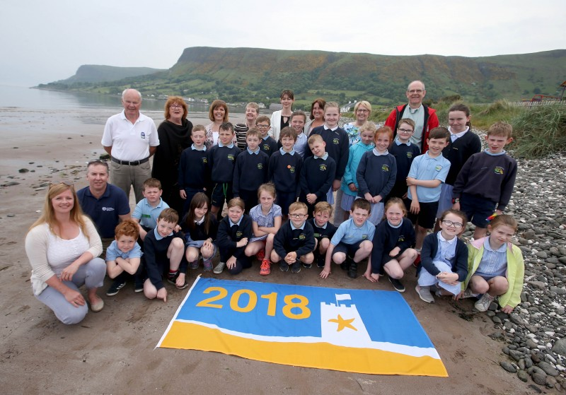 Pupils and teachers from St Patrick's Primary School in Glenariff pictured with Michael McConaghy from Causeway Coast and Glens Borough Council’s Coast and Countryside Team, Jen Firth from Keep Northern Ireland Beautiful and representatives of Antrim Glens Tourism and Glenariff Improvement Group at the Seaside Award flag celebration at Waterfoot Beach.