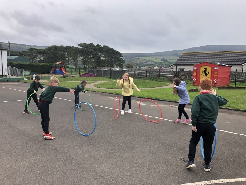 Pupils from St Aidan’s Primary School, Magilligan, enjoy a hula-hoop activity as part of the Heritage Games organized by Causeway Coast and Glens Borough Council.