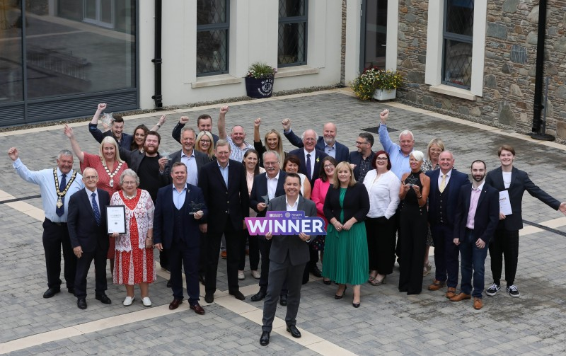 Coleraine retailers, along with the Mayor of Causeway Coast and Glens Borough Council Councillor Ivor Wallace, celebrate their joint win of High Street of the Year at the High Street Heroes Awards.