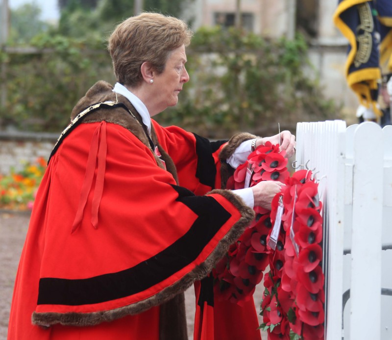 The Mayor of Causeway Coast and Glens Borough Council, Councillor Joan Baird OBE, lays a wreath at the war memorial in Ballycastle.
