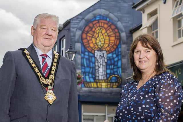 Housing Executive Chair Nicole Lappin is joined by Mayor of Causeway Coast and Glens Councillor Steven Callaghan to admire the striking artwork on the gable wall of the Housing Executive’s Coleraine Office. Credit McAuley_Multimedia