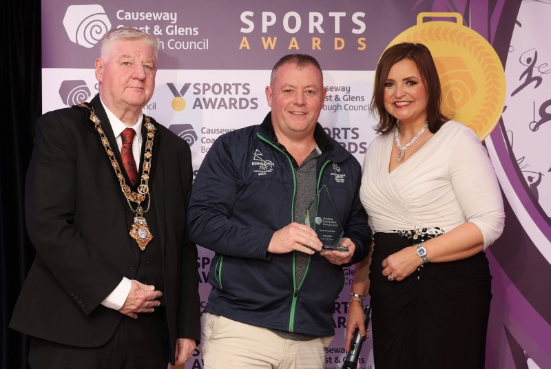 Sportsman of the Year, Ian McClure accepting his award from Denise Watson and Mayor of Causeway Coast and Glens, Councillor Steven Callaghan.