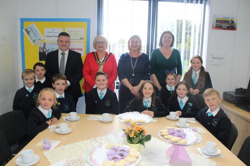 The Mayor of Causeway Coast and Glens Borough Council, Councillor Brenda Chivers pictured enjoying afternoon tea with staff and pupils from Roe Valley Integrated Primary School.