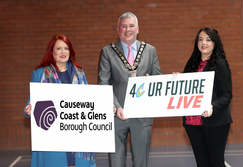 Greta Wilson receives a bespoke glass paperweight as part of Causeway Coast and Glens Borough Council’s Platinum Jubilee gift initiative from the Mayor, Councillor Richard Holmes.