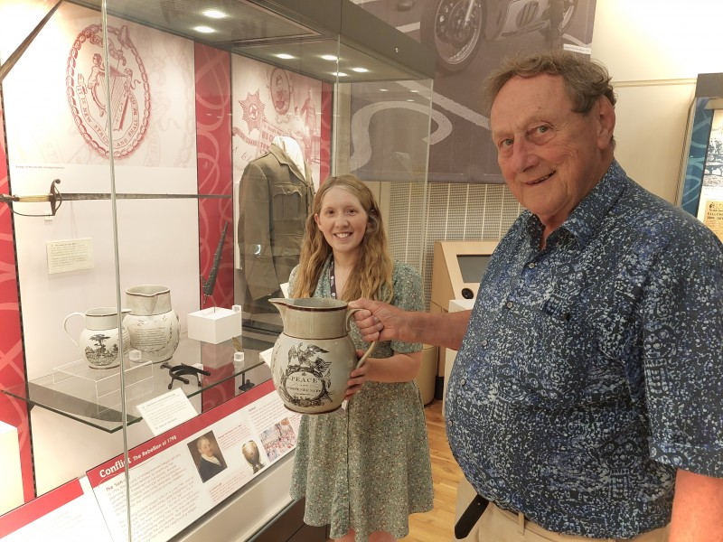 Museum Officer Jamie Austin with donor Prof Eric Colhoon