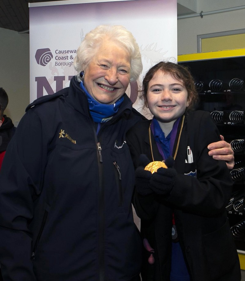 Lady Mary Peters pictured with a young competitor at the schools sports Coleraine organised by Causeway Coast and Glens Borough Council.