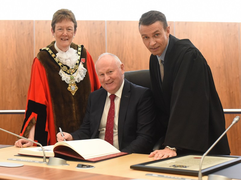 The new Freeman of the Borough of Causeway Coast and Glens Mervyn Whyte pictured with the Mayor, Councillor Joan Baird OBE and Council Chief Executive David Jackson.