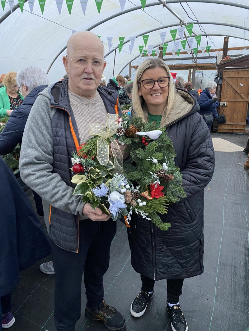 Move More participant Paddy Canning and his daughter displaying their Christmas wreath