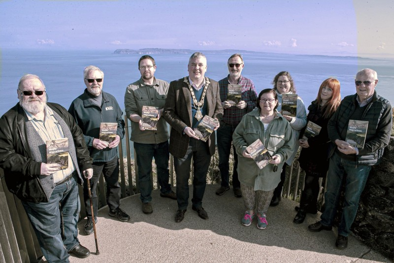 The Mayor of Causeway Coast and Glens Borough Council, Councillor Richard Holmes, pictured with some of the the contributors to the booklet (from left to right): Peter Molloy, Roger Perritt, Nic Wright (Museum Services Community Engagement Officer), Cllr Richard Holmes, Brian Molloy, Brigene Mc Neilly, Geraldine Anslow, Orla Duncan and Donnell O’Loan at Portaneevy Viewpoint looking across the Sea of Moyle to Rathlin Island.