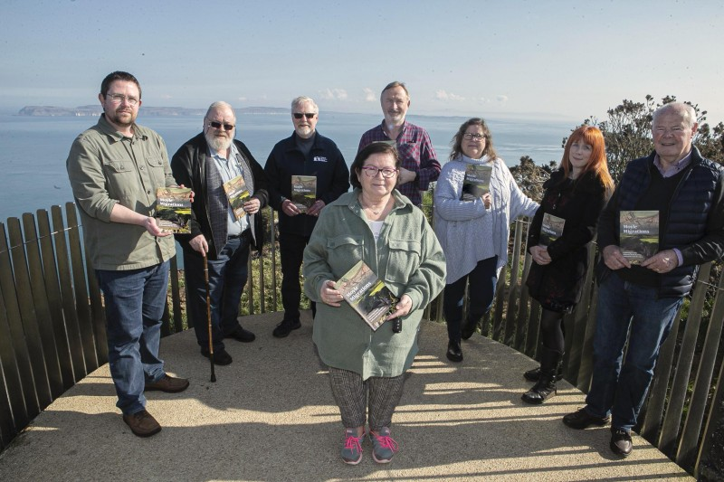 Nic Wright, Community Engagement Officer at Causeway Coast and Glens Borough Council Museum Services (left) pictured at Portaneevy Viewpoint community volunteers who contributed to the ‘Moyle Migrations’ booklet: Peter Molloy, Roger Perritt, Brigene Mc Neilly, Brian Molloy, Geraldine Anslow, Orla Duncan and Donnell O’Loan.