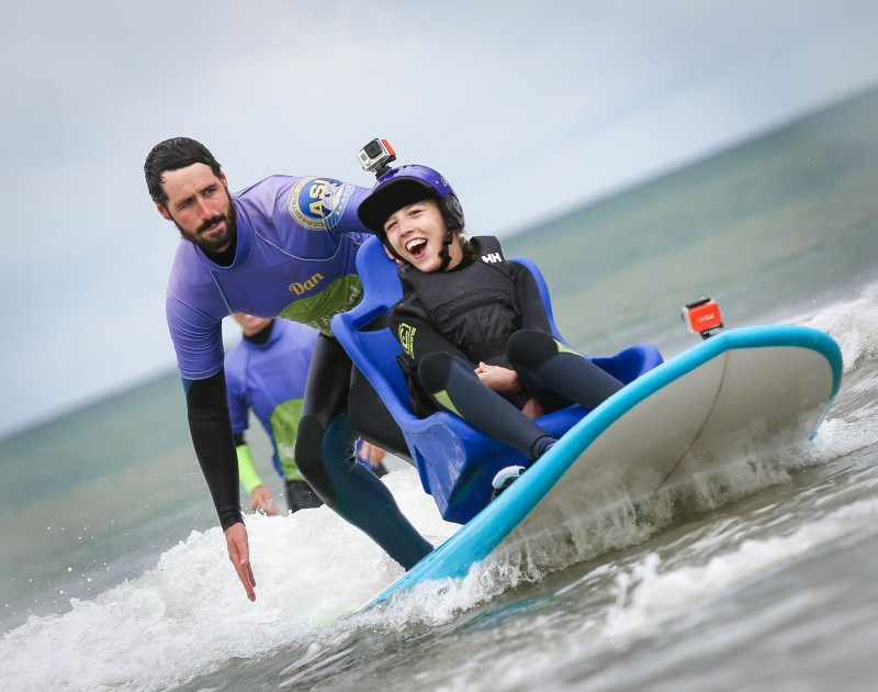 Eighteen year old Talia McDowell tries out Northern Ireland's first surfboard suitable for wheelchair users  at the announcement of Benone beach in Limavady as Northern Ireland's first fully inclusive beach.