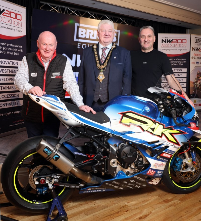 Mayor of Causeway Coast and Glens, Councillor Steven Callaghan with NW200 event director Mervyn Whyte on the and racer Michael Rutter