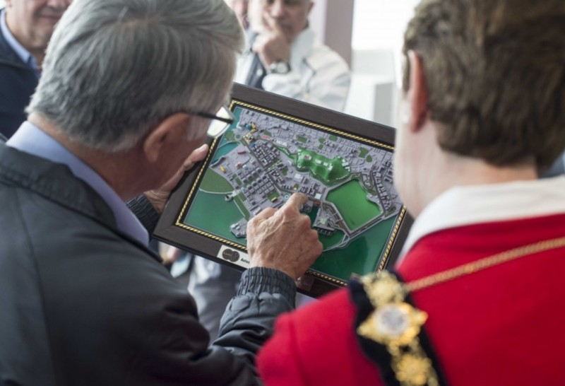 Patrick Castro, Track Manager of Macau Grand Prix, shows a map of the area to the Mayor of Causeway Coast and Glens Borough Council Councillor Joan Baird OBE.