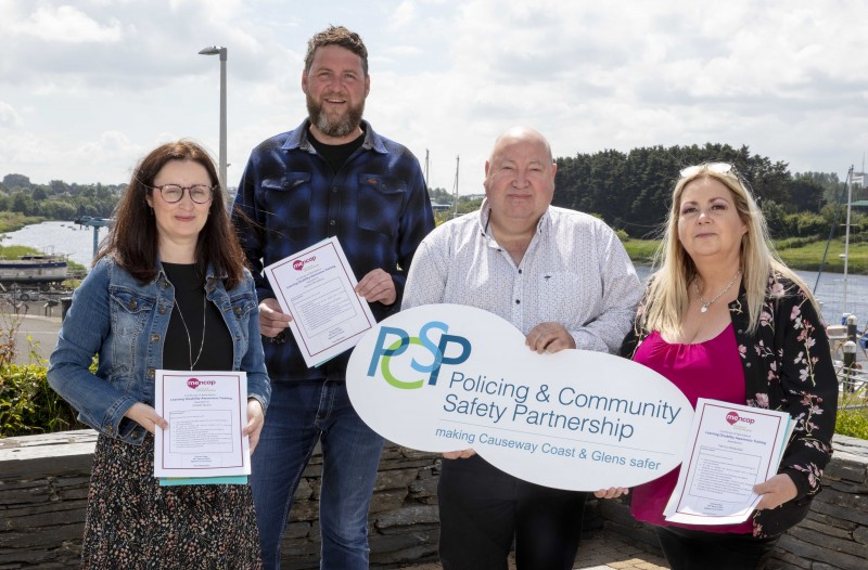 Alderman Adrian McQuillan, PSCP chairperson, and Patricia McQuillan, PCSP Independent Member (far right) receive their Mencap Learning Disability Awareness Training certificates from PCSP Officers Orlaith Quinn and Michael McCafferty.