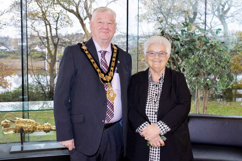 Mayor of Causeway Coast and Glens, Councillor Steven Callaghan smiling alongside local woman Margaret Peacock at her Mayoral reception in Cloonavin